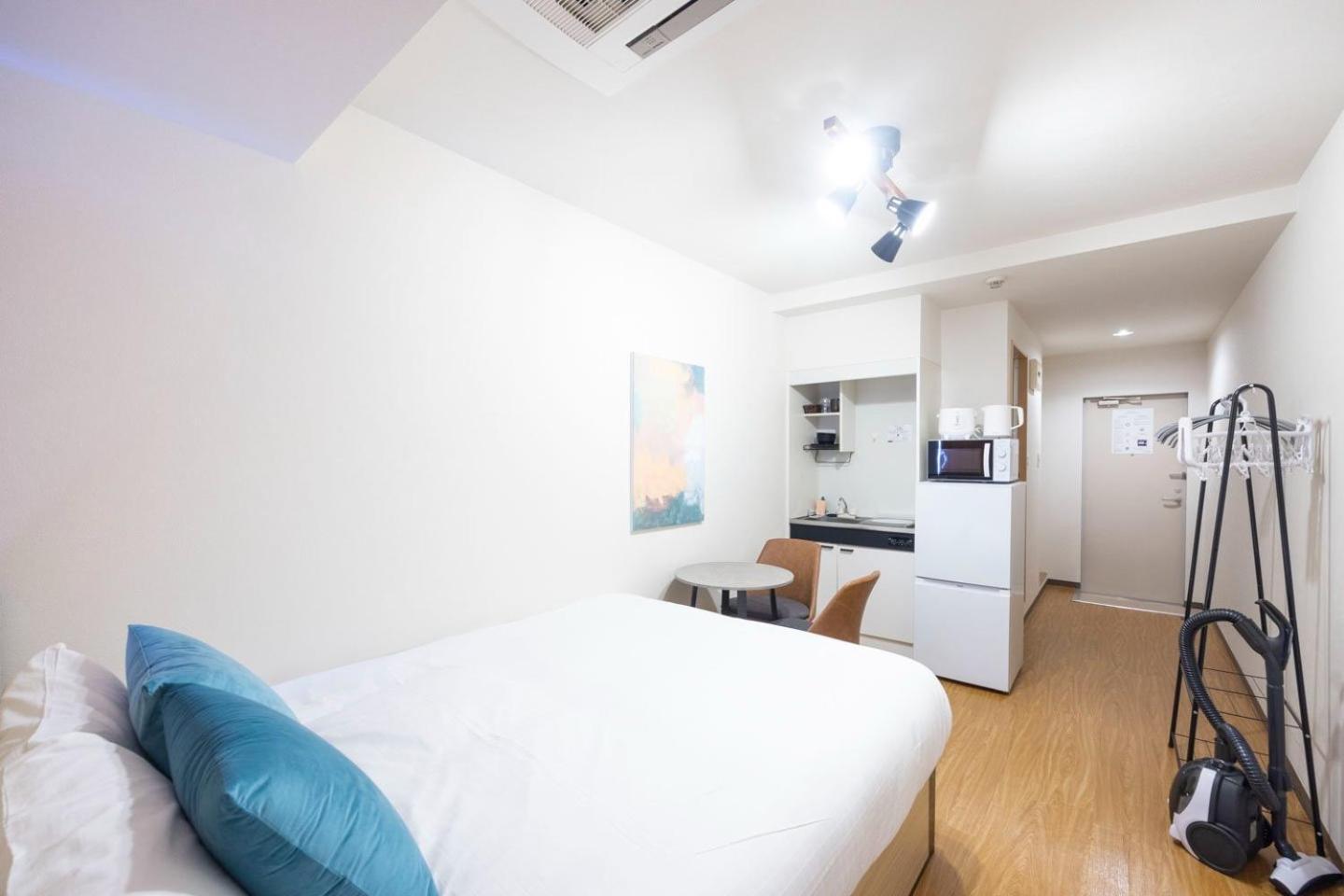 Апартаменты Shinjuku Okada Building Токио Номер фото